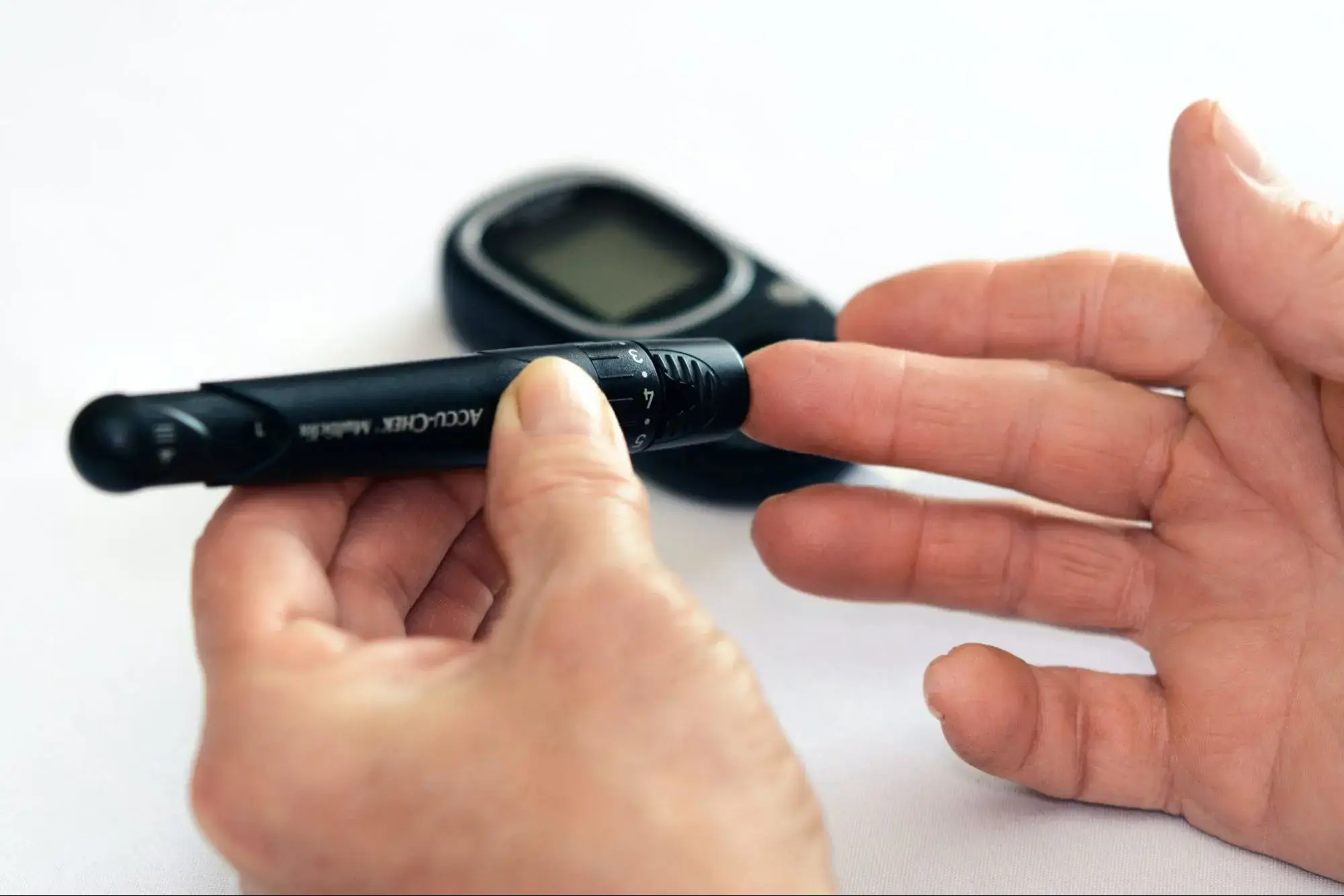 A person with diabetes checking their blood sugar levels.