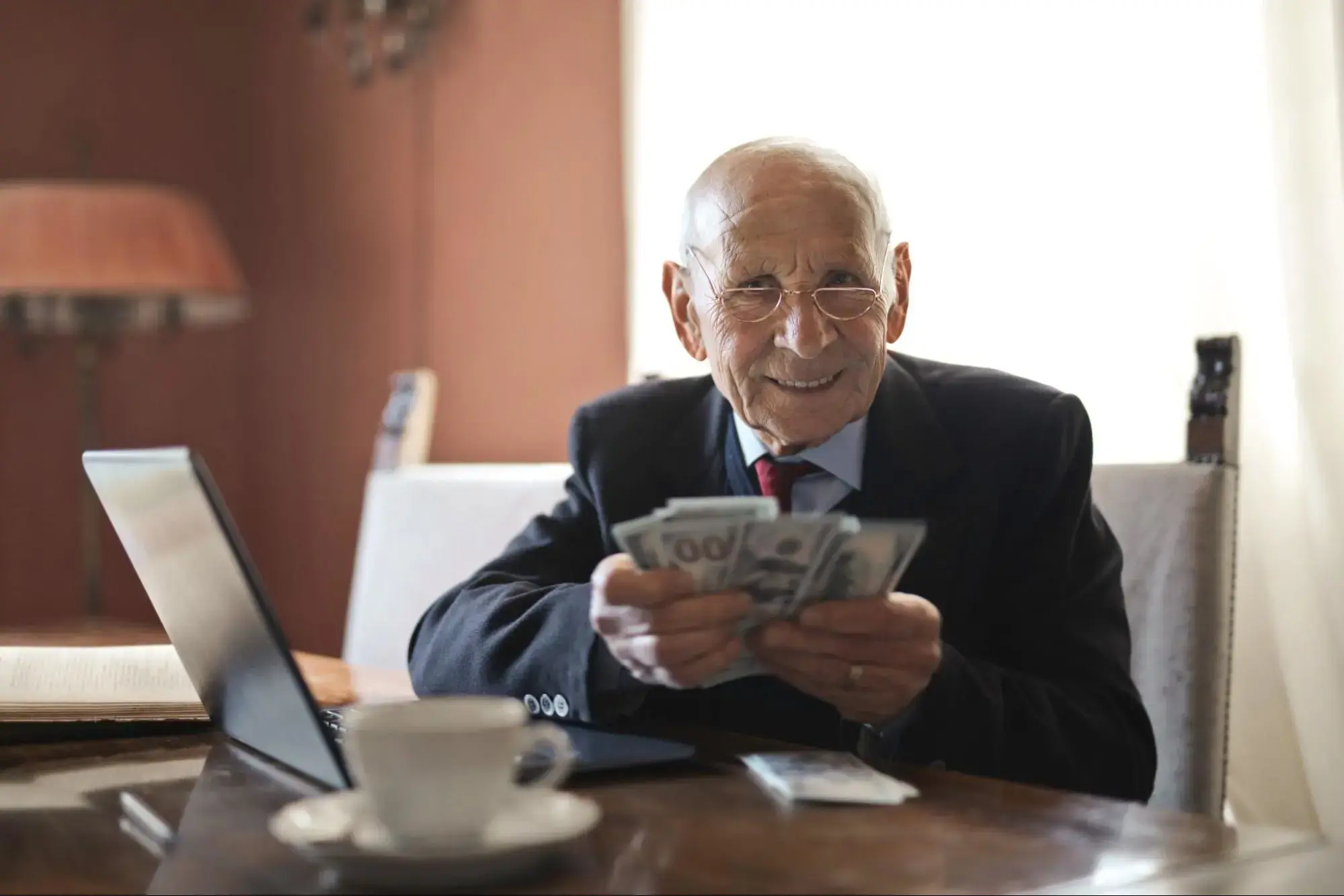 An elderly man with his cash value.