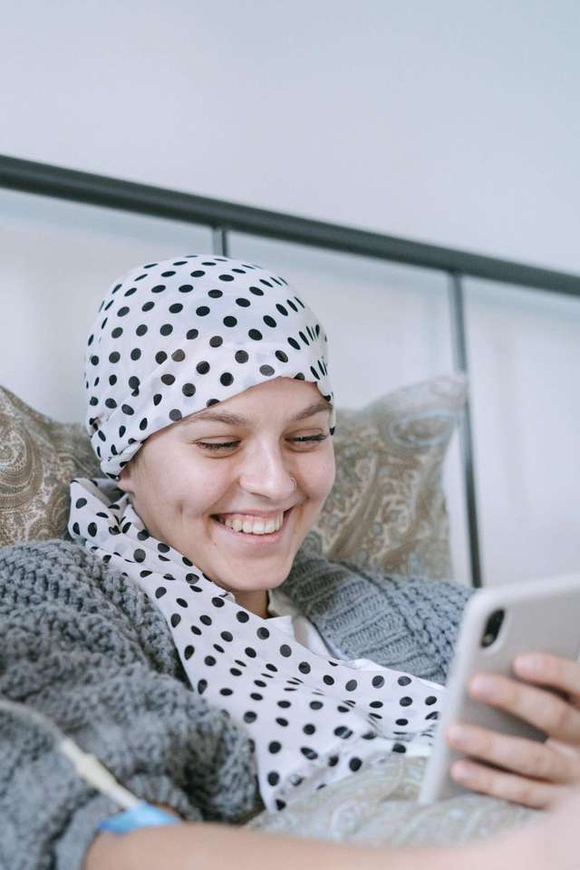 Source: https://www.pexels.com/photo/smiling-woman-in-white-and-black-polka-dot-hijab-using-silver-ipad-6436252/